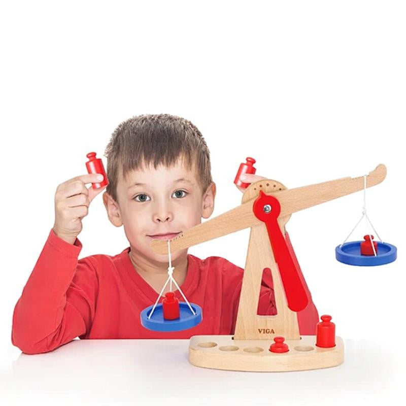 child playing with toy scales